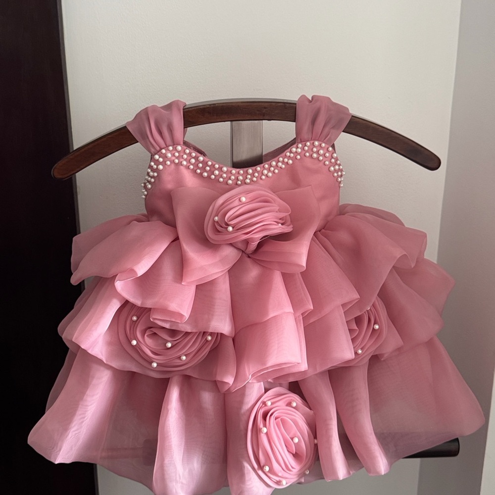 Baby girl Pink Ruffled Dress with Pearl Accents. Perfect for birthday